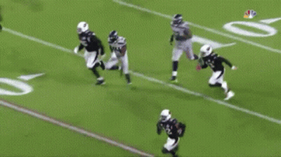 Football Player Number 14 Tackled GIF