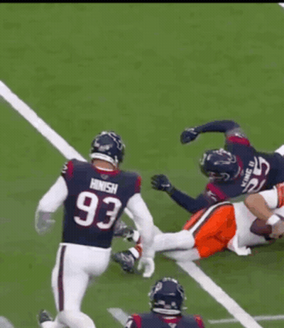 Football Player Number 15 Being Tackled