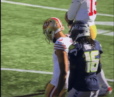 Football Player Number 15 Beside Another GIF