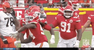 Football Player Number 15 In Front Of Flames GIF