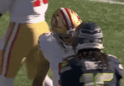 Football Player Number 15 Next To Another Player GIF
