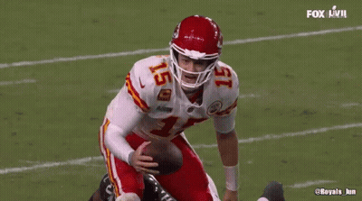 Football Player Number 15 On Helmet Standing On Field GIF