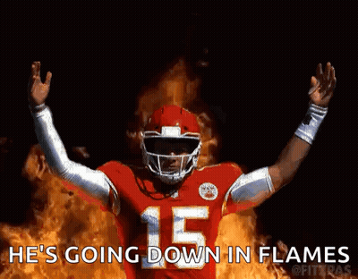 Football Player Number 15 Standing In Front Of Flames GIF
