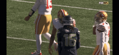 Football Player Number 16 Talking To Another GIF