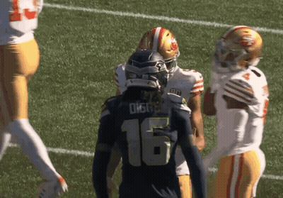 Football Player Number 16 Talking To Another GIF