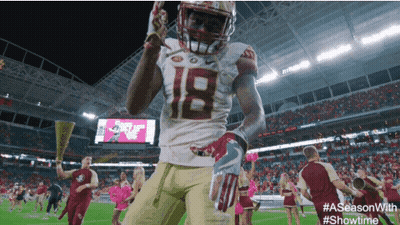 Football Player Number 18 Celebrating On Field GIF