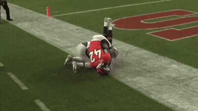 Football Player Number 18 Kneeling On Field GIF