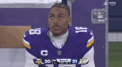 Football Player Number 18 Looking At Scoreboard GIF
