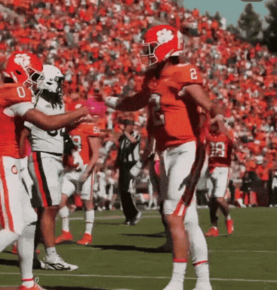 Football Player Number 2 Being Hugged By Another Player GIF