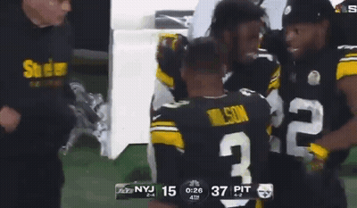 Football Player Number 2 Hugging Another Player GIF