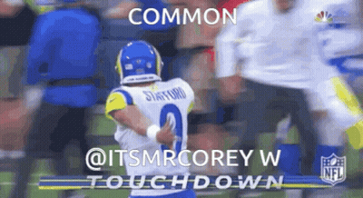 Football Player Number 2 Hugging Another Player GIF