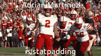 Football Player Number 2 Running With Teammates GIF