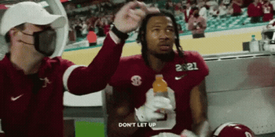 Football Player Number 21 Holding Gatorade Bottle GIF