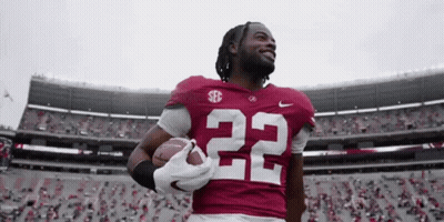 Football Player Number 22 Holding Football GIF