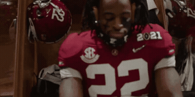 Football Player Number 22 Sitting Eyes Closed In Locker Room GIF