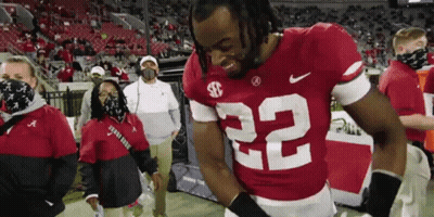 Football Player Number 22 Standing On Field GIF
