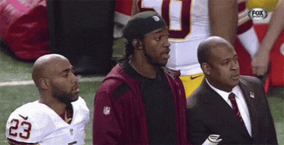 Football Player Number 23 Beside Two Men GIF