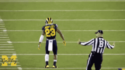 Football Player Number 23 Standing Next To Referee GIF