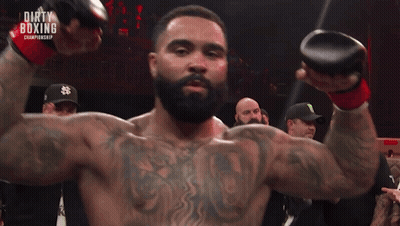 Football Player Number 24 Holding Helmet In Front Of Crowd GIF