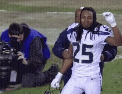 Football Player Number 25 Being Carried GIF