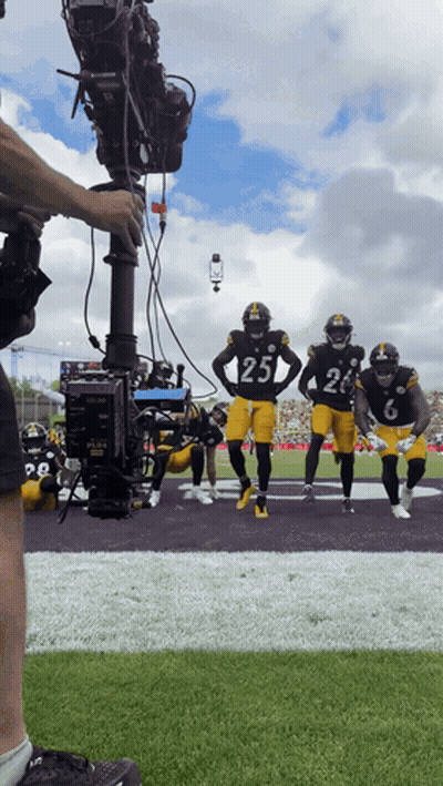 Football Player Number 25 Being Filmed GIF