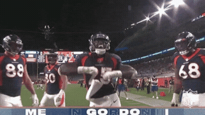 Football Player Number 25 Dancing With Teammates GIF
