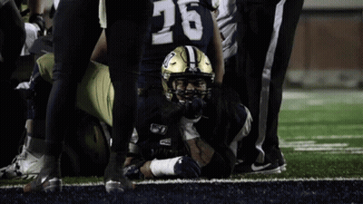 Football Player Number 26 Laying On Field GIF