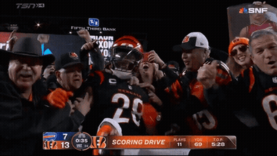Football Player Number 28 Surrounded By Fans GIF