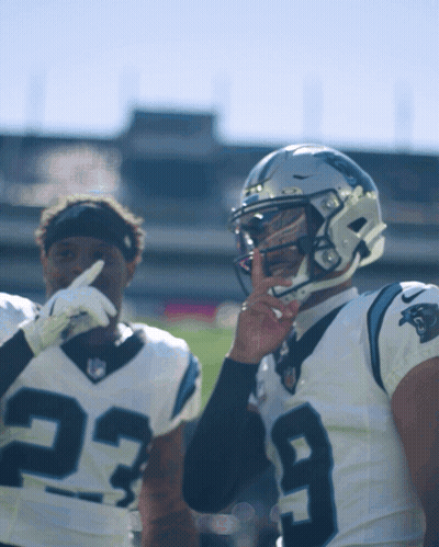 Football Player Number 29 Talking To Another Player GIF