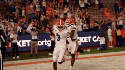 Football Player Number 3 Celebrating With Teammate GIF
