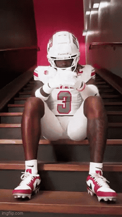 Football Player Number 3 Sitting On Stairs GIF
