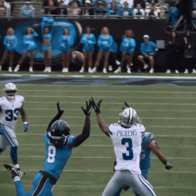 Football Player Number 3 Trying To Catch Ball GIF