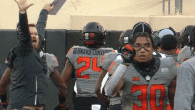 Football Player Number 30 In Front Of Group GIF