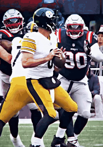 Football Player Number 30 Running With Ball