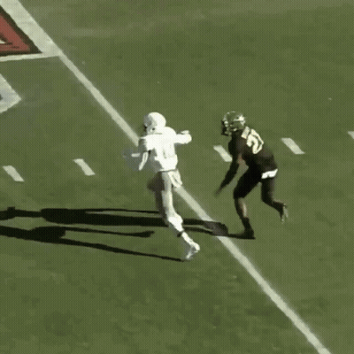 Football Player Number 31 Catching Ball