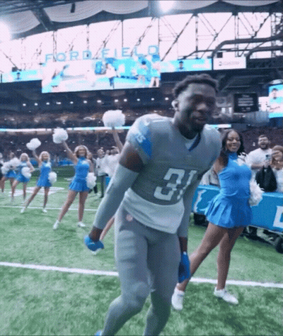 Football Player Number 31 With Cheerleaders GIF
