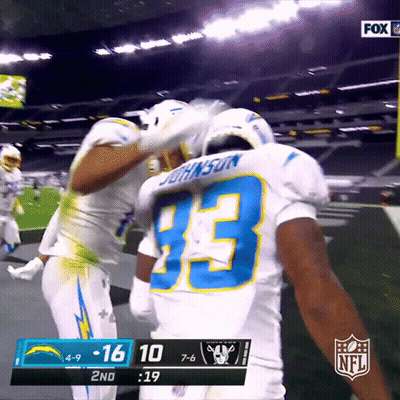 Football Player Number 33 Hugging Another Player GIF
