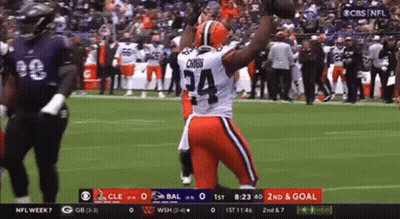 Football Player Number 34 Holding Football In Air GIF