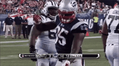 Football Player Number 35 Hugging Another Player GIF