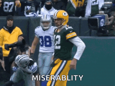 Football Player Number 38 Standing Next To Another Player GIF
