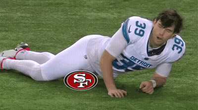 Football Player Number 39 Laying On Ground GIF