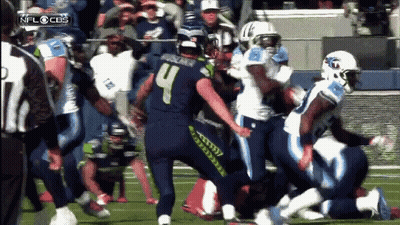Football Player Number 4 Being Tackled GIF