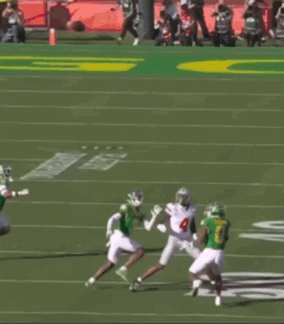 Football Player Number 4 Catching Pass GIF