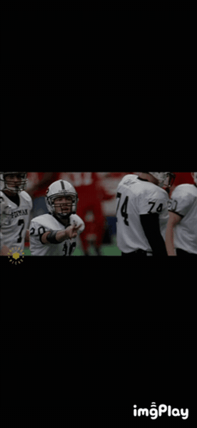 Football Player Number 4 In Huddle With Teammates GIF