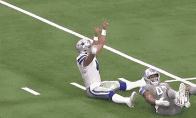 Football Player Number 4 Laying On Ground GIF