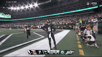 Football Player Number 45 Talking To Another Player GIF