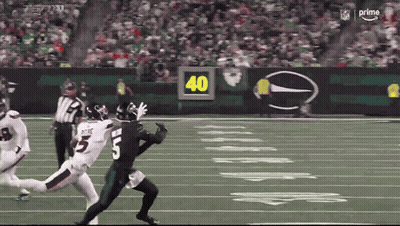 Football Player Number 5 Being Tackled GIF