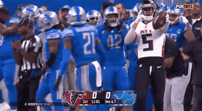 Football Player Number 5 In Front Of Group GIF