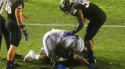 Football Player Number 5 Laying On Ground GIF