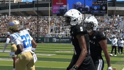 Football Player Number 5 Next To Another Player GIF